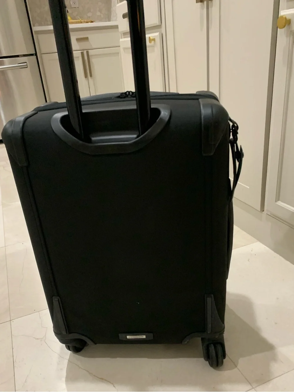 Tumi Black Spinner Carry-On with Front Zip Pocket luggage